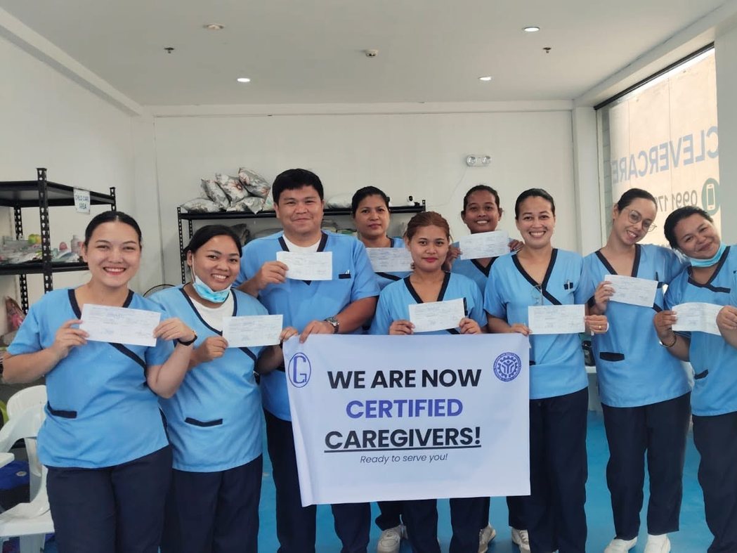 CleverCare students celebrating as newly certified caregivers