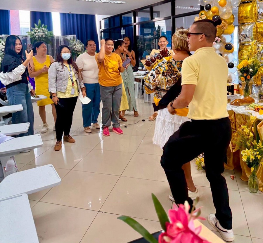 CleverCare students and staff dancing during a branch celebration