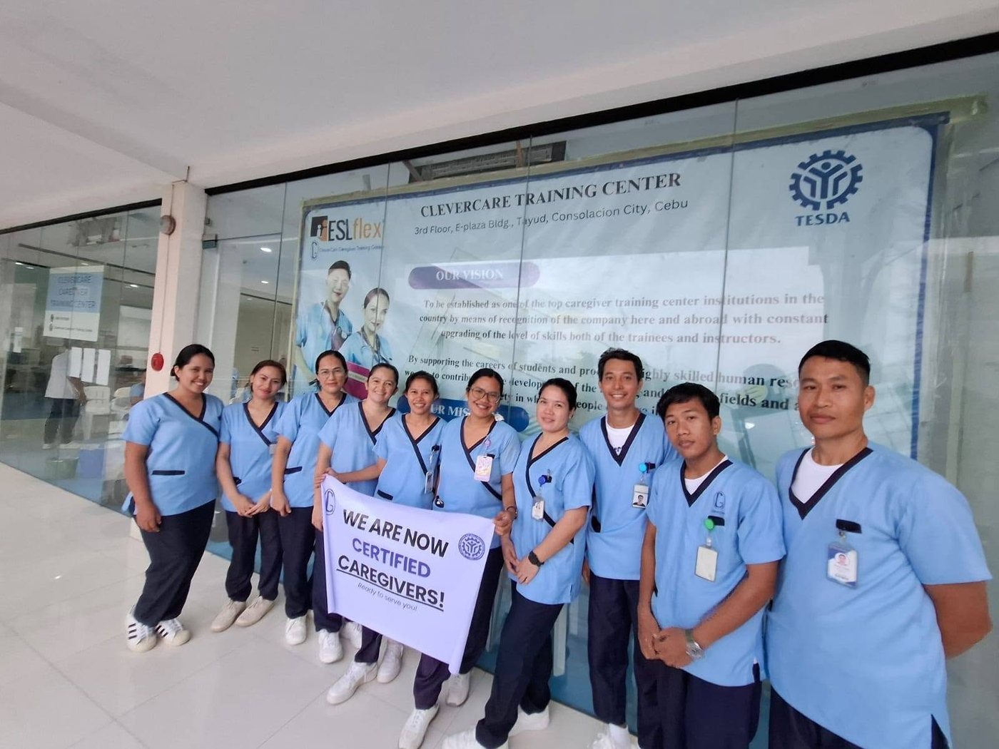 CleverCare Consolacion students celebrating as newly certified caregivers, outside the Tayud branch