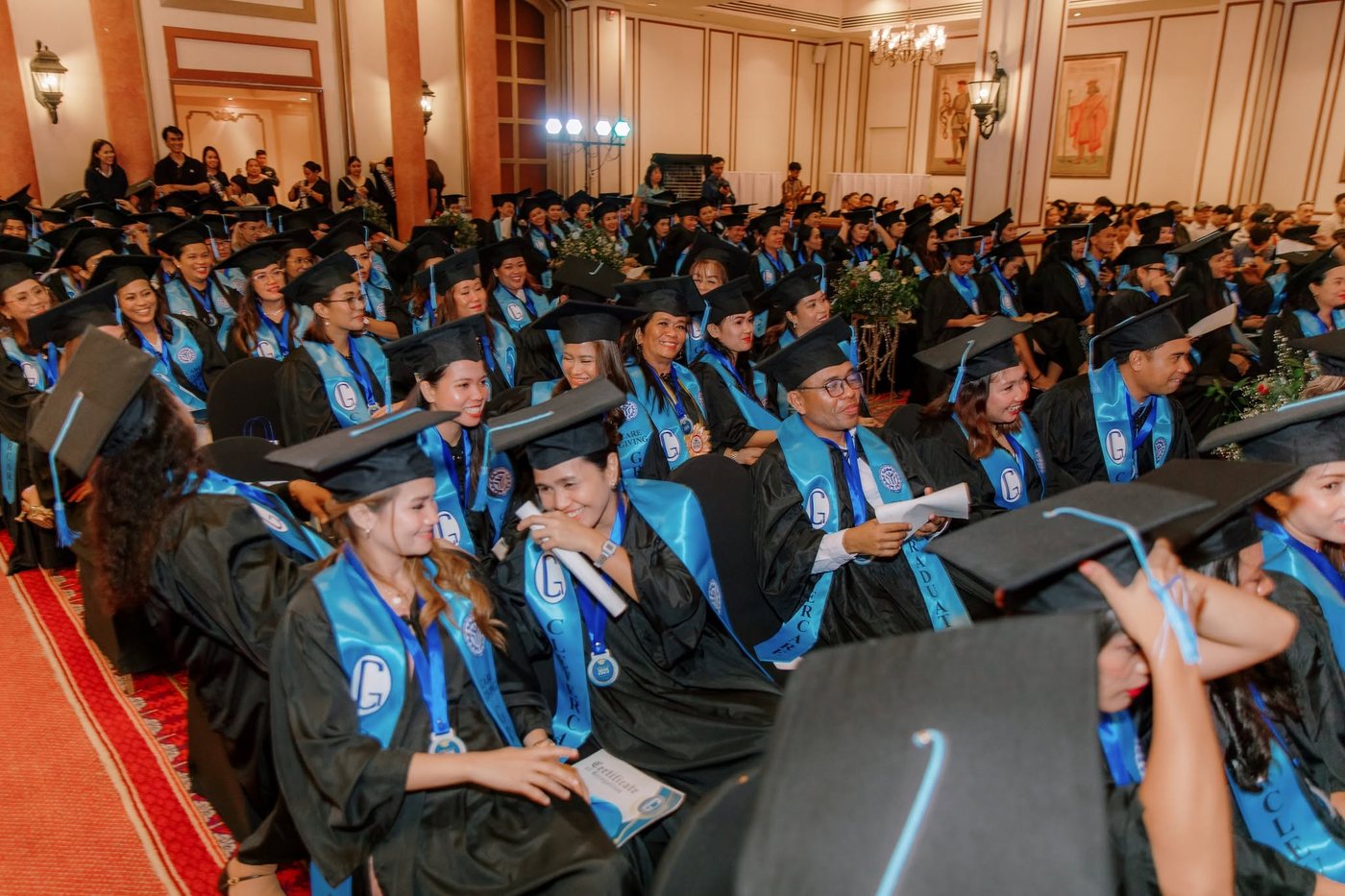 CleverCare graduation ceremony, full ballroom of graduates
