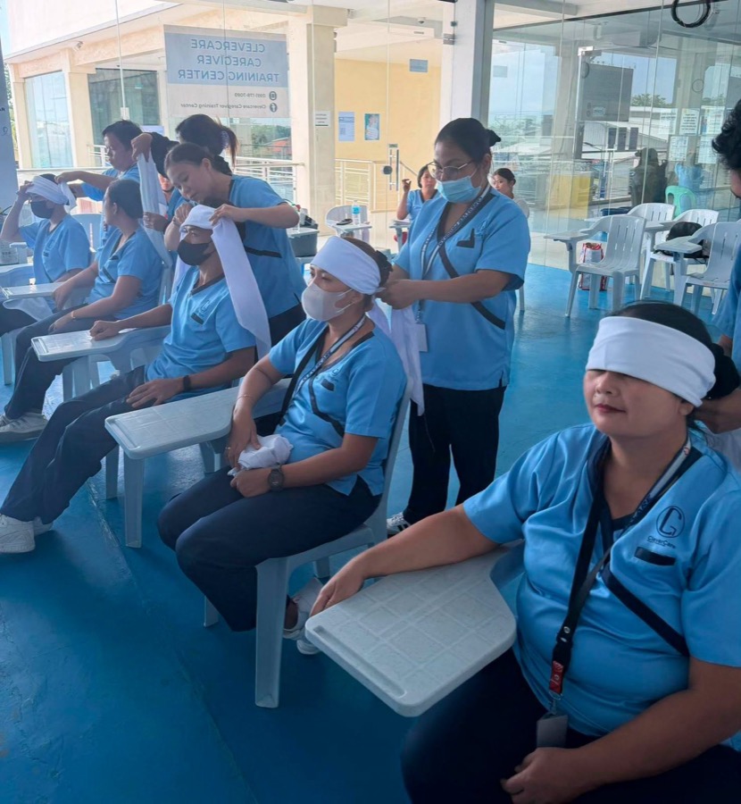 CleverCare students in a blindfolded sensory awareness practicum
