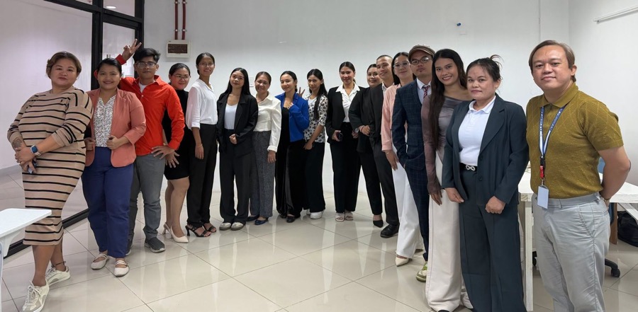 CleverCare staff and graduates in business attire at the office